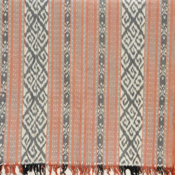 Ikat tekstil med striber og snirkler - orange &amp; gr